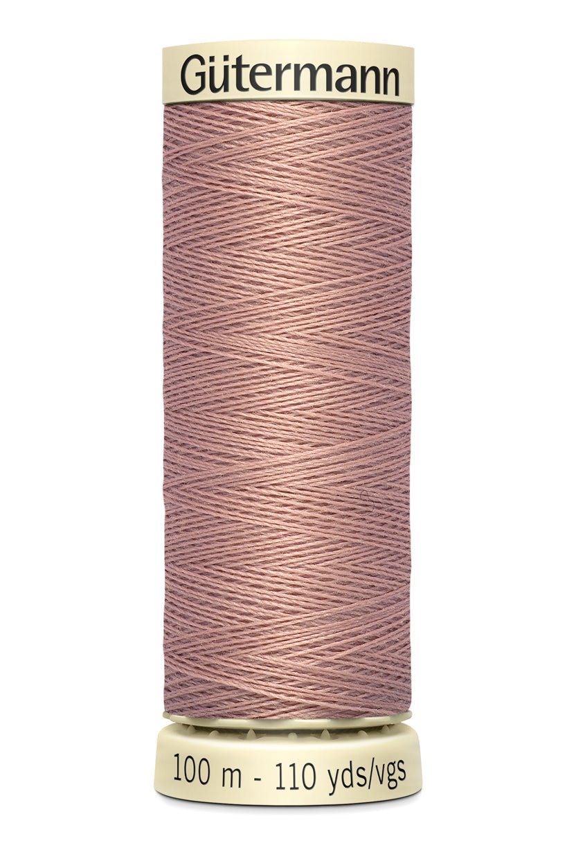 Gütermann Sew-All thread, 100% polyester, 100m spool in a muted rose color.