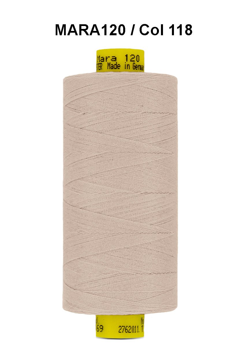 A spool of light beige Gutermann Mara 120 thread.