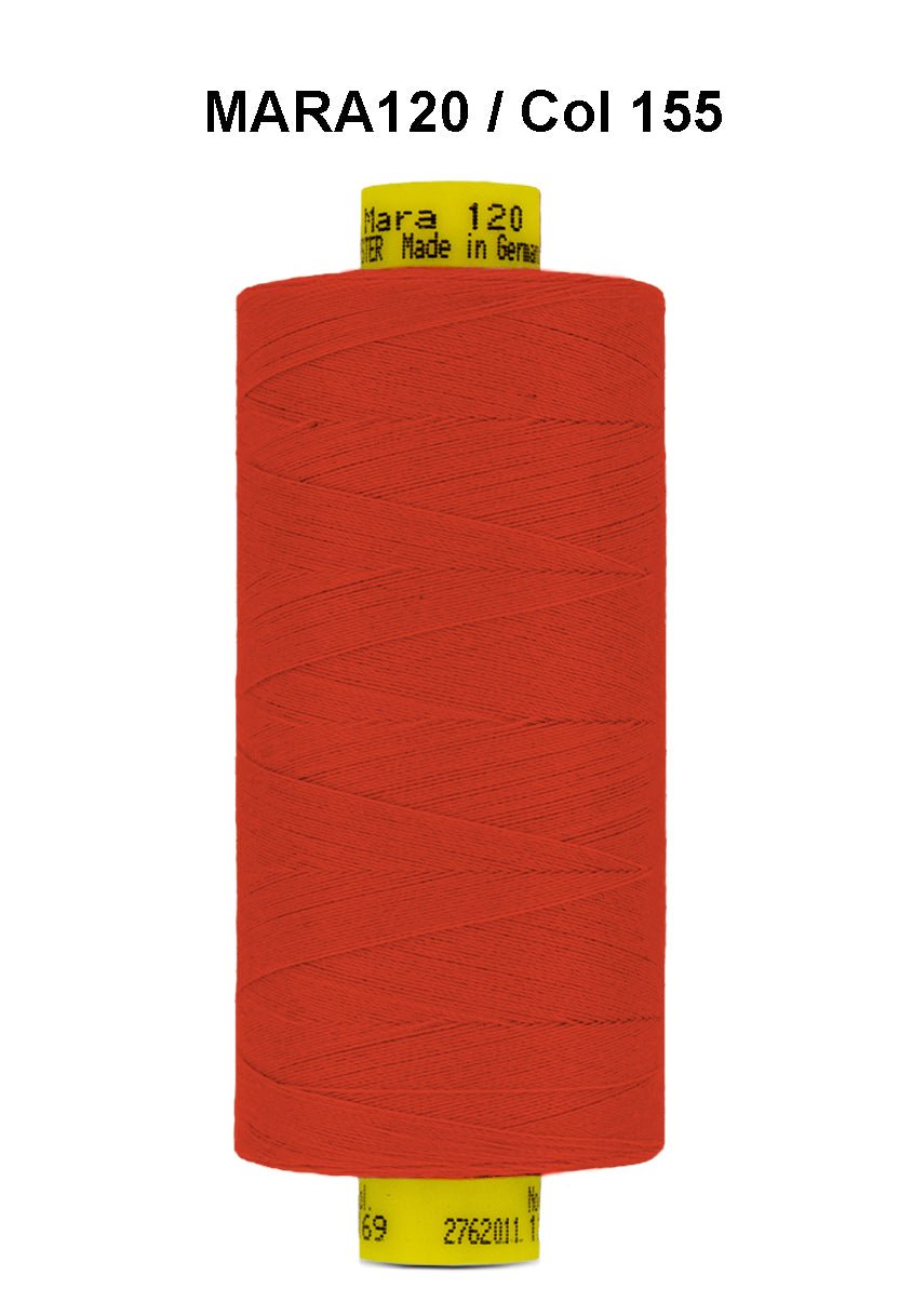 A spool of bright orange Gutermann Mara 120 thread.