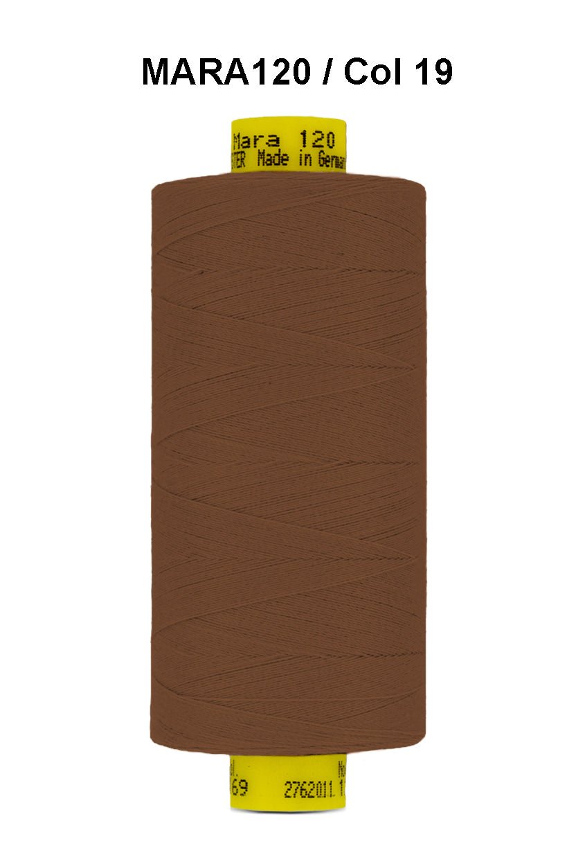 Brown Mara 120 polyester thread on a spool.