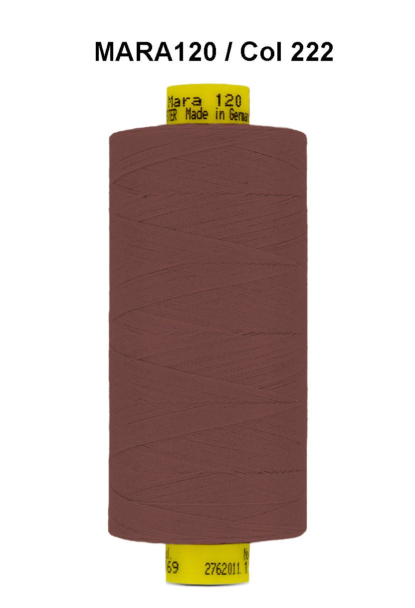 A spool of brown Gutermann Mara 120 thread with label information.