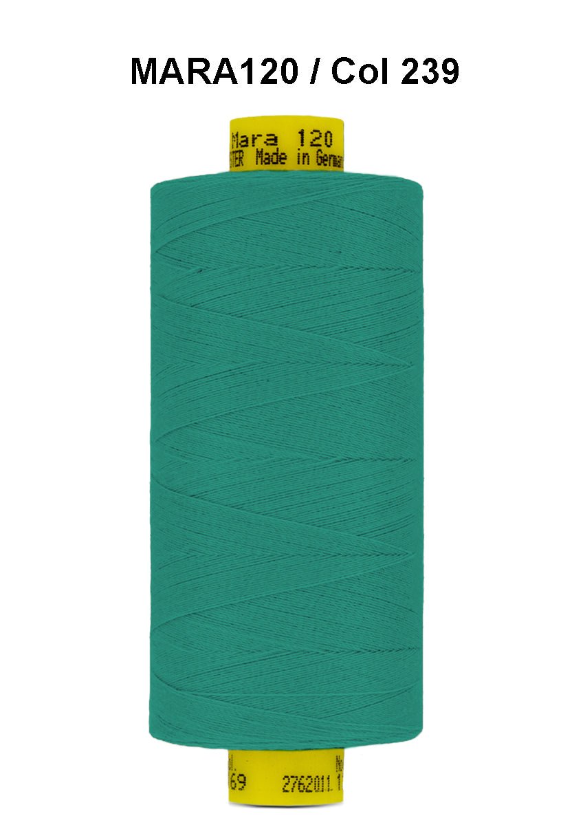 Teal green Gutermann Mara 120 polyester thread on a spool.