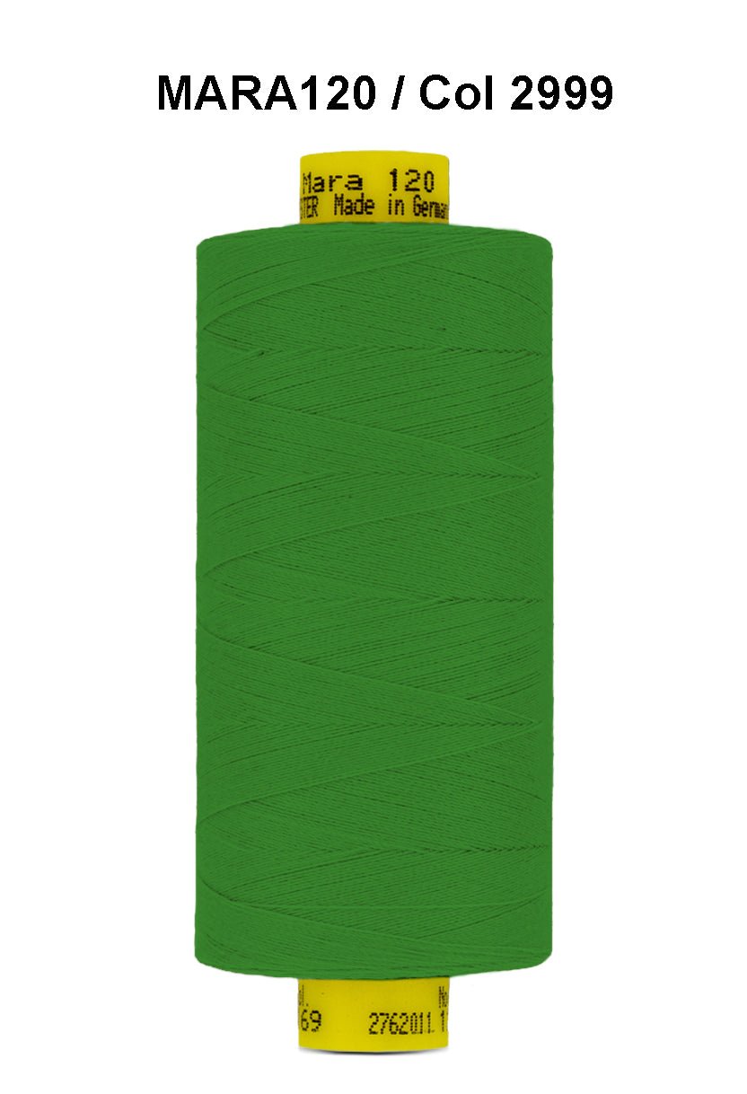 Green Gutermann Mara 120 polyester thread on a spool.