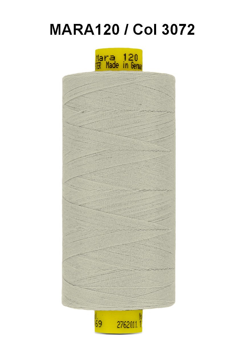 Gutermann Mara 120 thread in a light grey color on a spool.