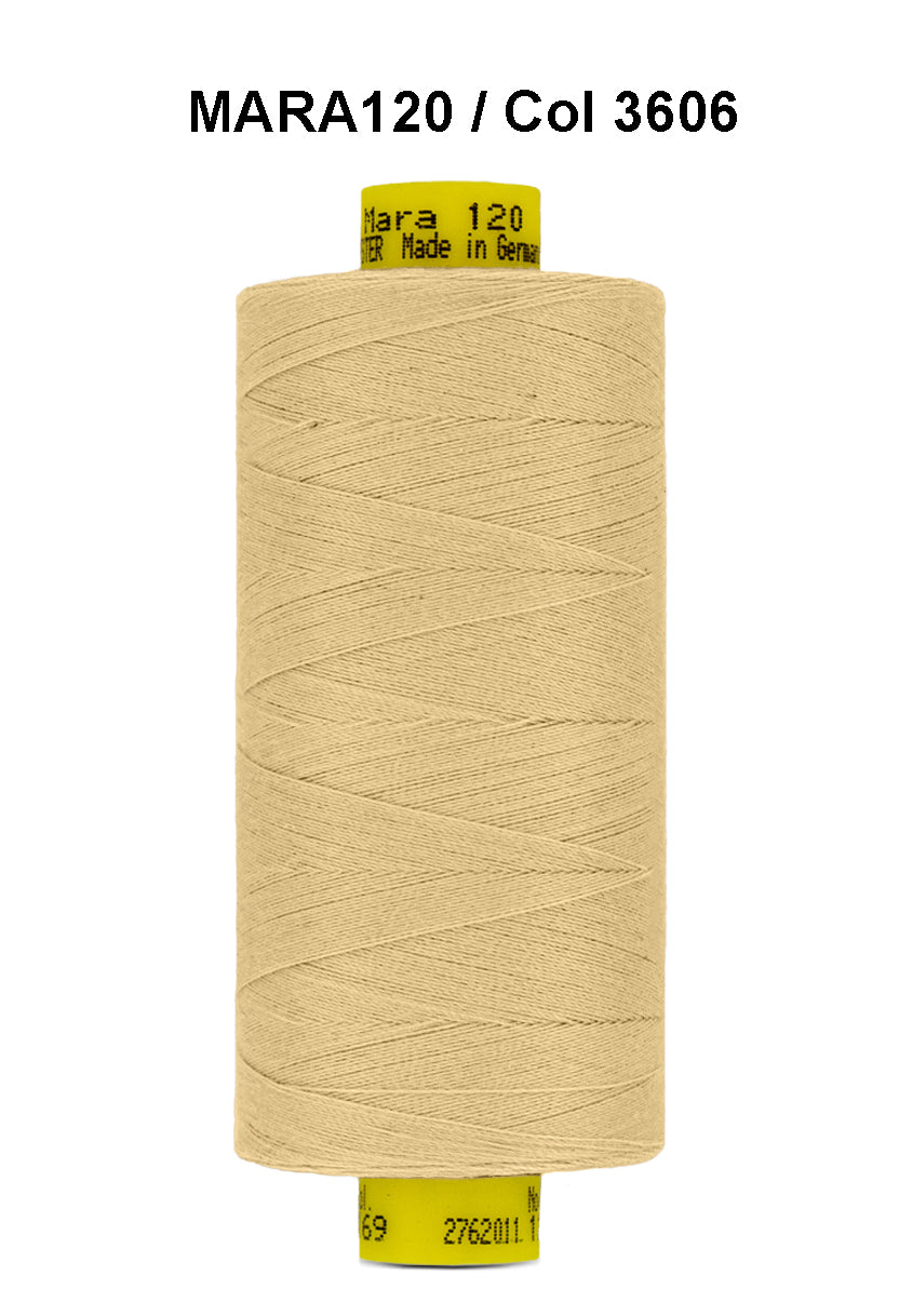 A spool of light beige Gutermann Mara 120 thread.
