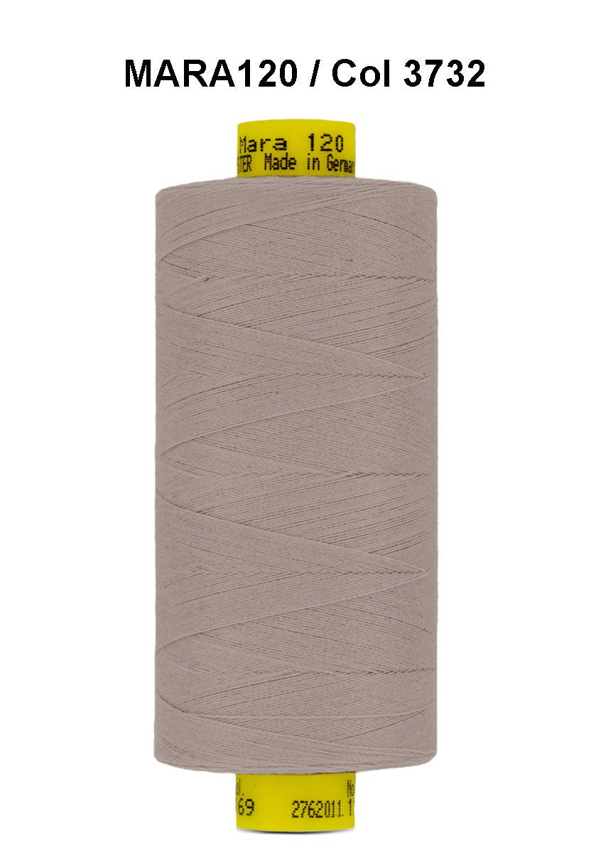 Gutermann Mara 120 thread in a light brown color on a spool.