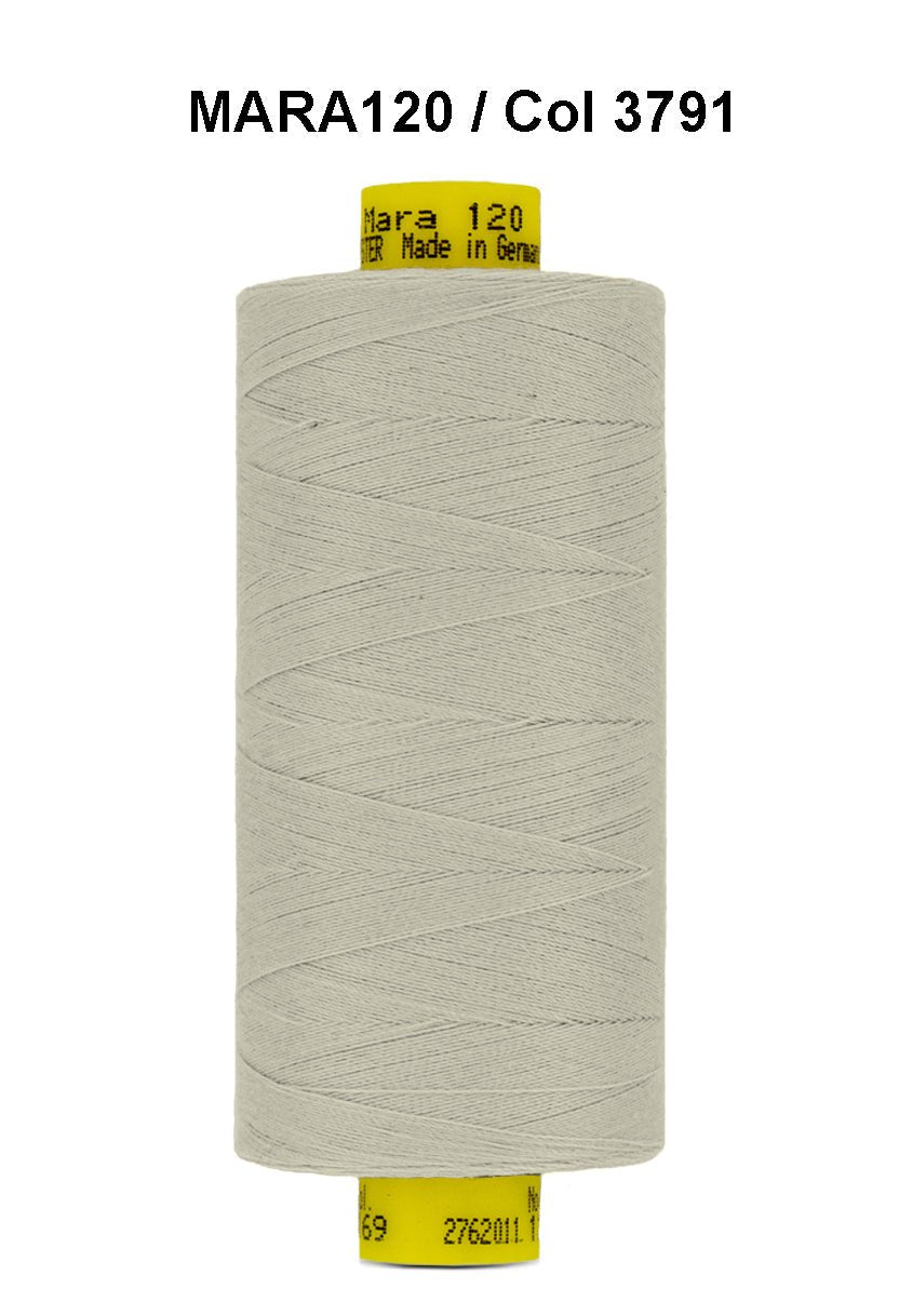 Gutermann Mara 120 thread in a light grey color on a spool.