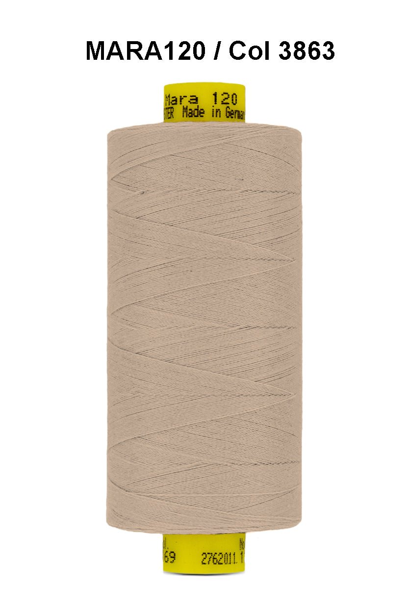 A spool of beige Gutermann Mara 120 thread.