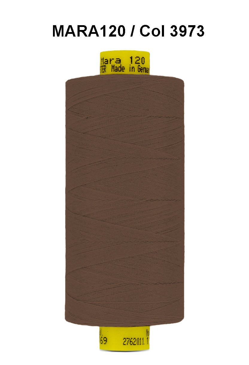 Brown Gutermann Mara 120 polyester thread on a spool.
