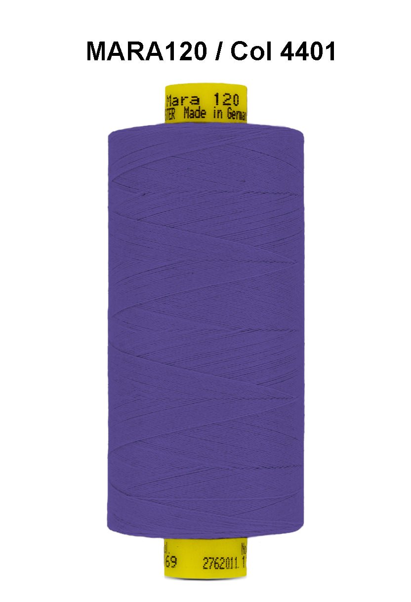 A spool of purple Gutermann Mara 120 thread with product information on the label.