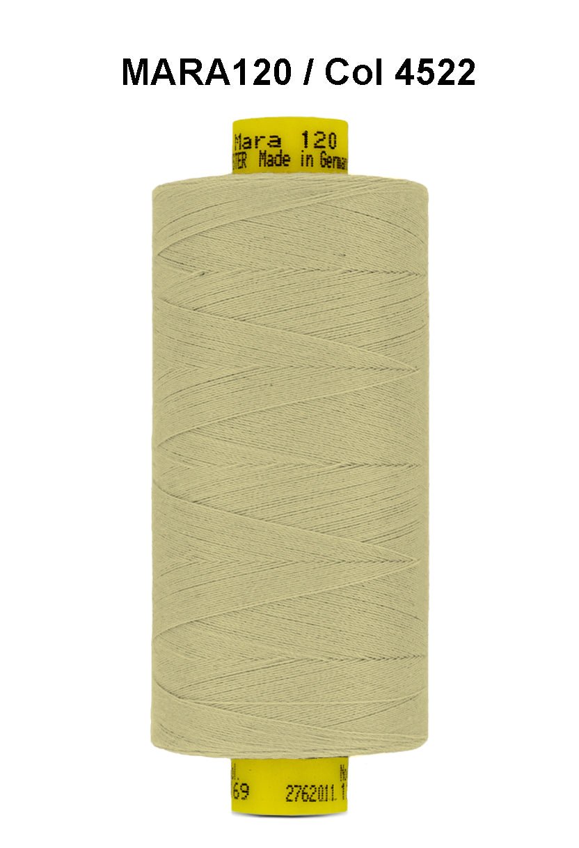 A spool of light beige Gutermann Mara 120 thread.