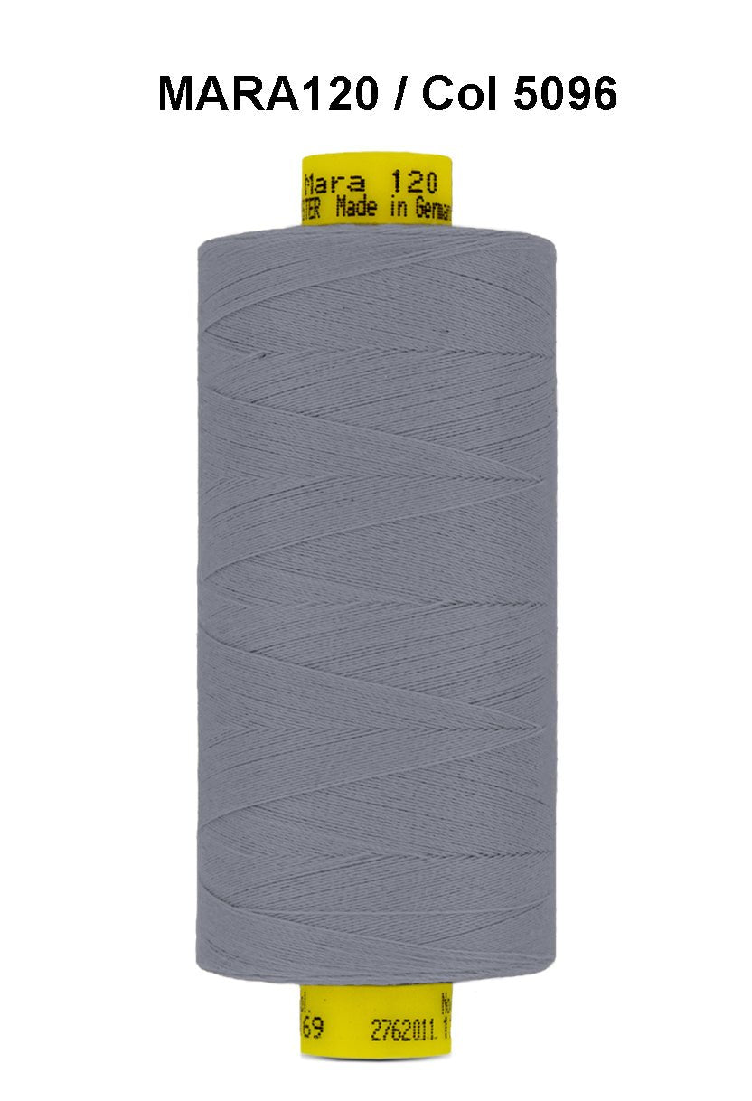 Gutermann Mara 120 grey polyester thread on a spool.