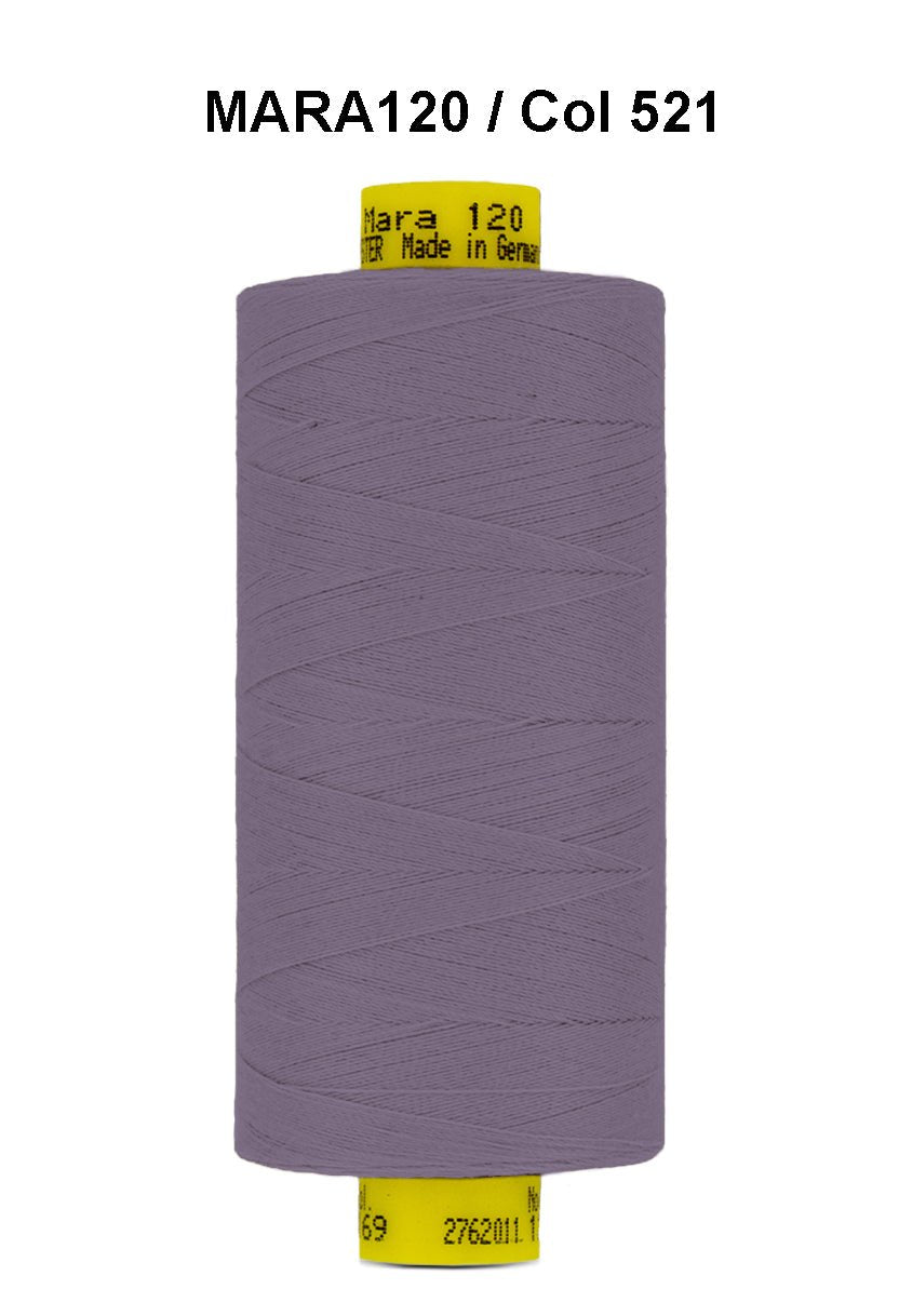 A spool of purple Gutermann Mara 120 thread with a yellow label.