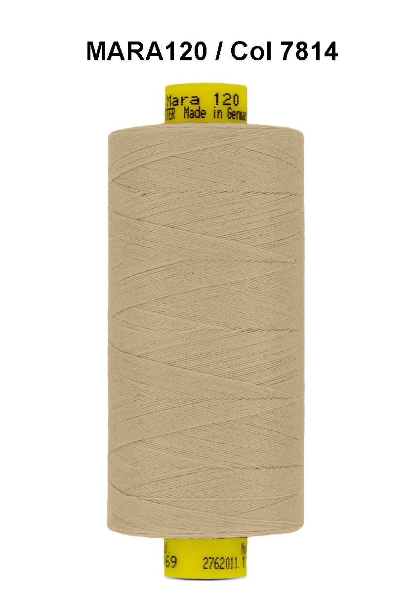 A spool of tan Mara 120 thread with text indicating it is made in Germany.