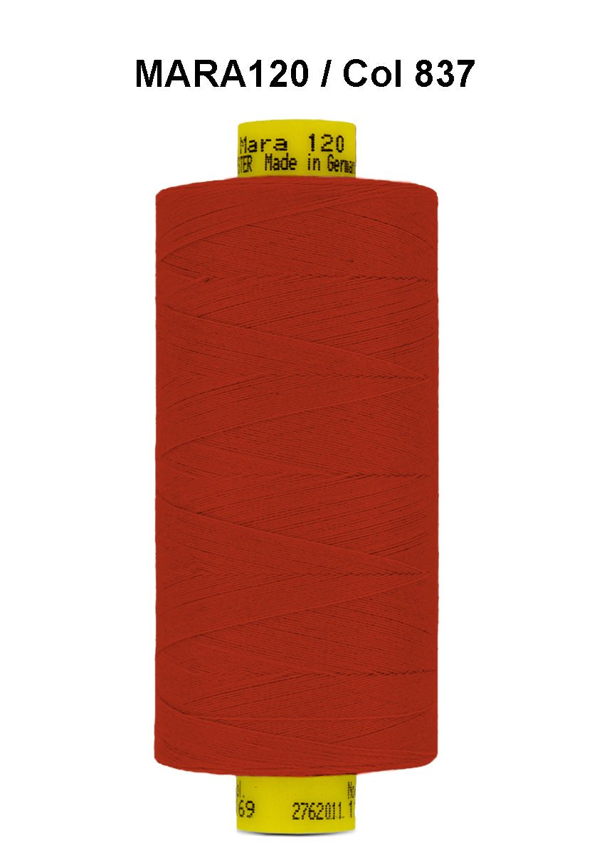 Gutermann Mara 120 polyester thread in red on a spool.