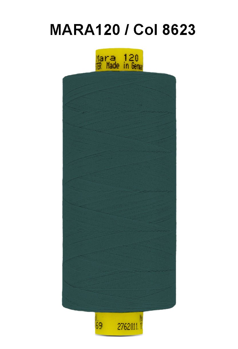 A spool of dark teal Gutermann Mara 120 thread with yellow labels.