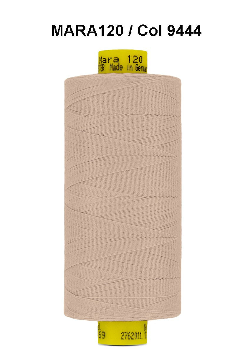 A spool of light beige Gutermann Mara 120 thread.