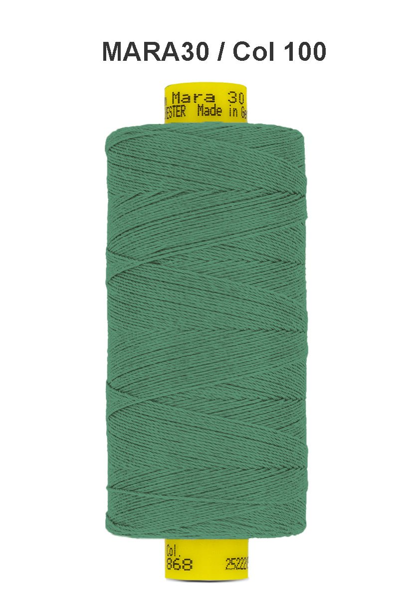 A spool of green Gutermann Mara 30 polyester thread.