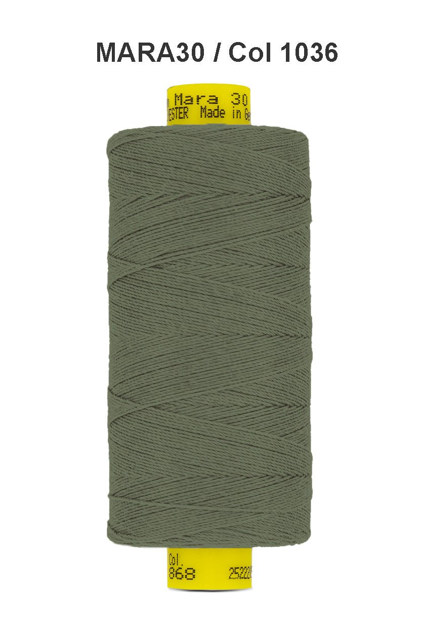 A spool of dark green Gutermann Mara 30 polyester thread.