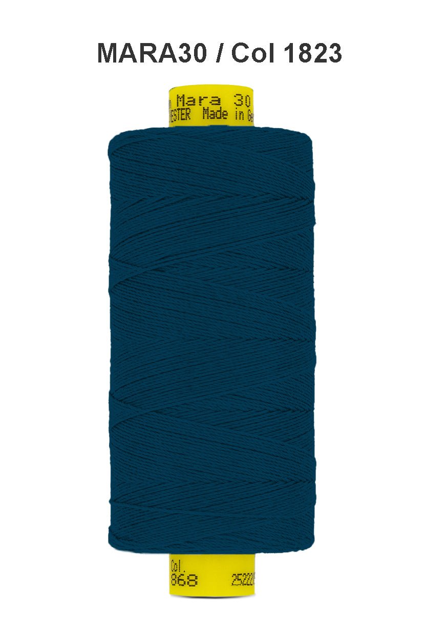 A spool of dark teal Gutermann Mara 30 polyester thread.