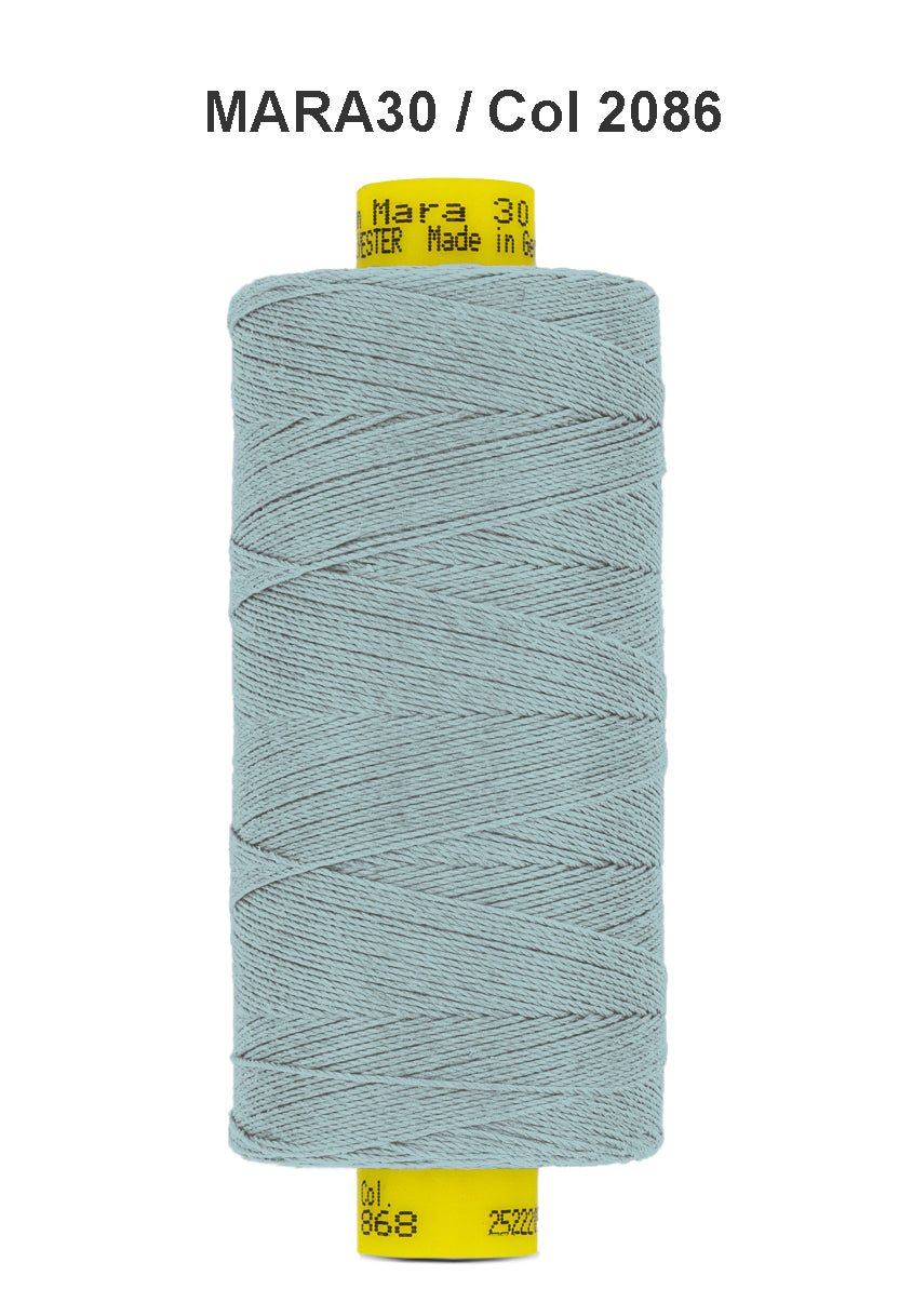 A spool of light blue Gutermann Mara 30 polyester thread.