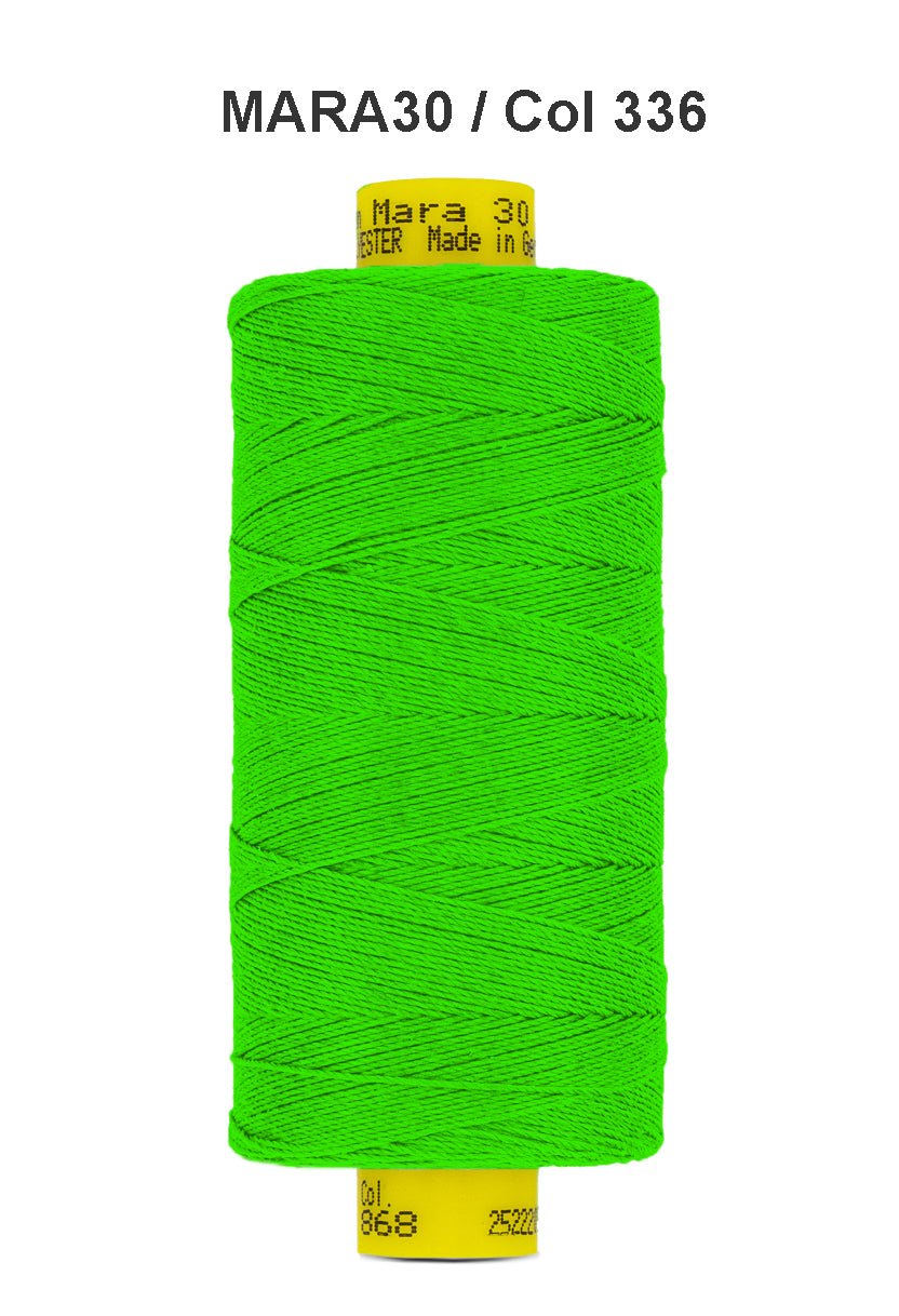 A spool of bright green Gutermann Mara 30 polyester thread.