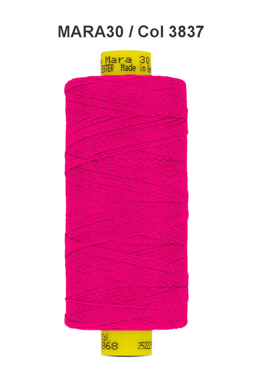 A spool of bright pink Gutermann Mara 30 polyester thread.