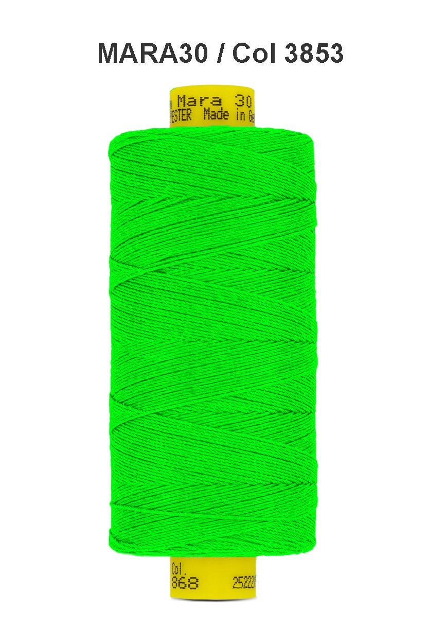 A spool of bright green Gutermann Mara 30 polyester thread.