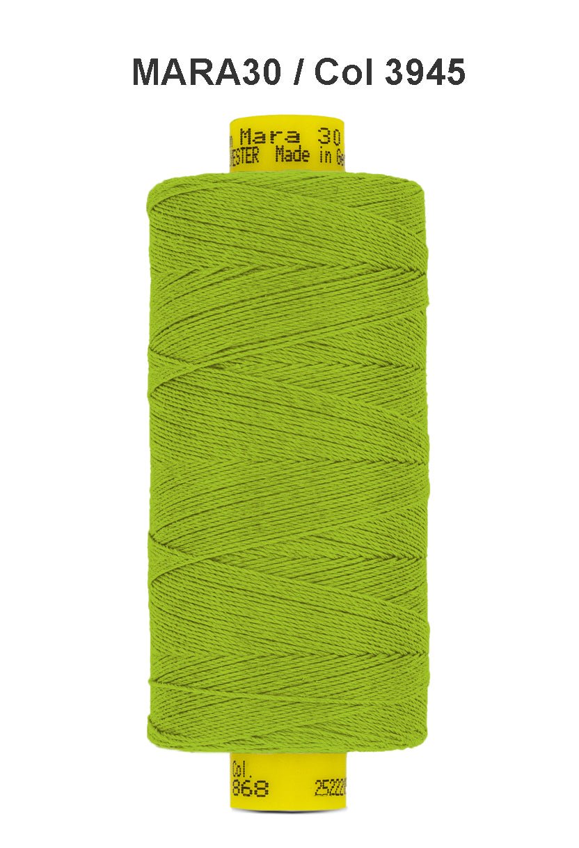 A spool of bright green Gutermann Mara 30 polyester thread.