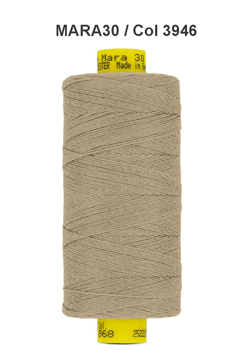 A spool of tan Gutermann Mara 30 polyester thread.