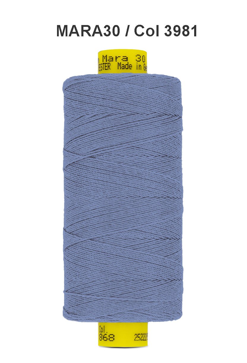 A spool of blue Gutermann Mara 30 polyester thread.