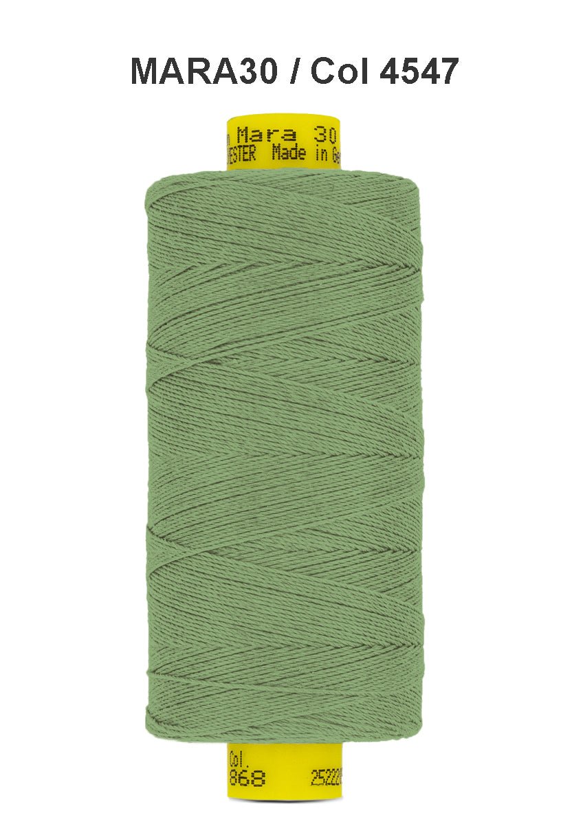 A spool of light green Gutermann Mara 30 polyester thread.