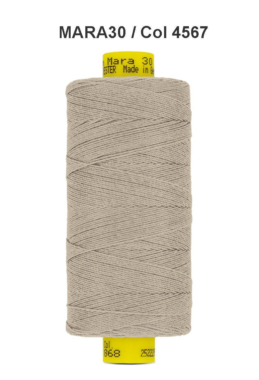 Gutermann Mara 30 polyester thread in a light beige color.