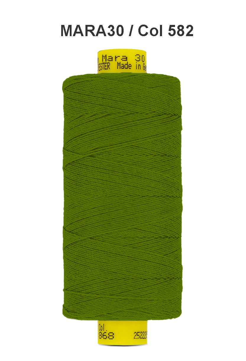 A spool of green Gutermann Mara 30 polyester thread.