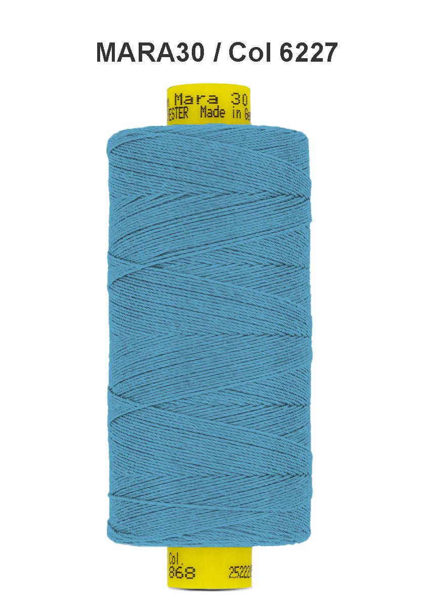 A spool of blue Gutermann Mara 30 polyester sewing thread.