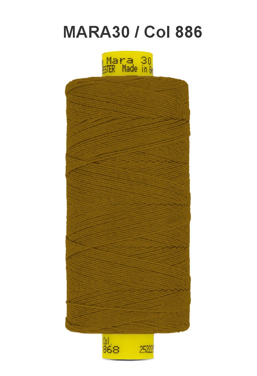 Brown Gutermann Mara 30 polyester thread on a spool.