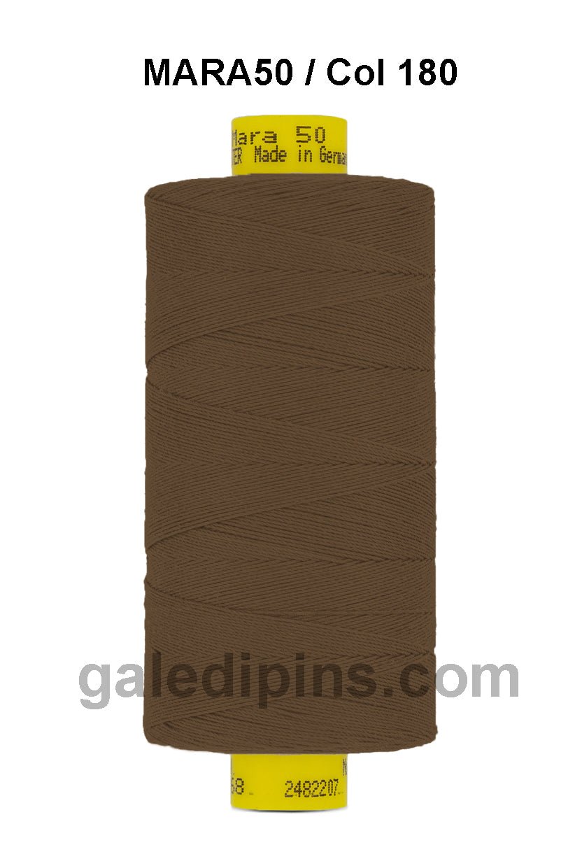 Brown Gutermann Mara 50 thread on a spool with yellow label.