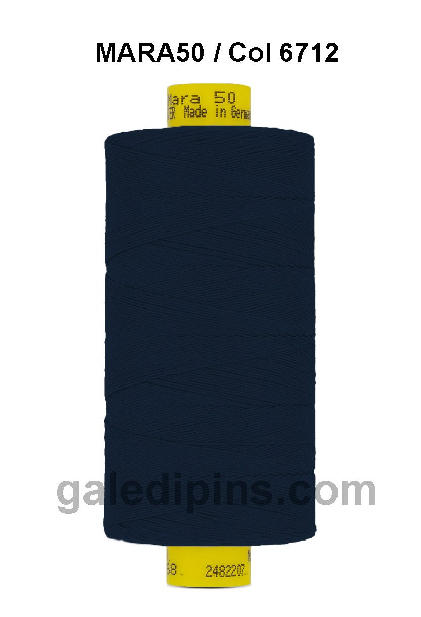 A spool of dark blue Gutermann Mara 50 thread with yellow labeling.