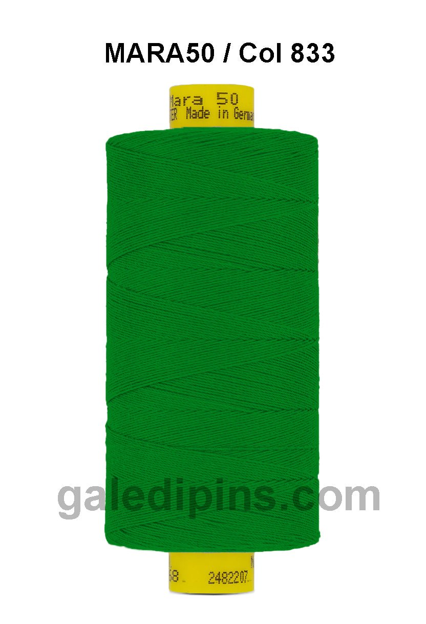 Green Gutermann Mara 50 polyester thread on a spool.