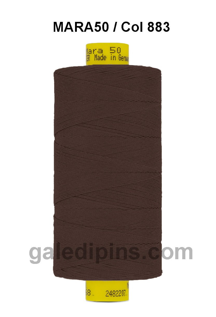 Brown Gutermann Mara 50 thread on a spool with yellow label.