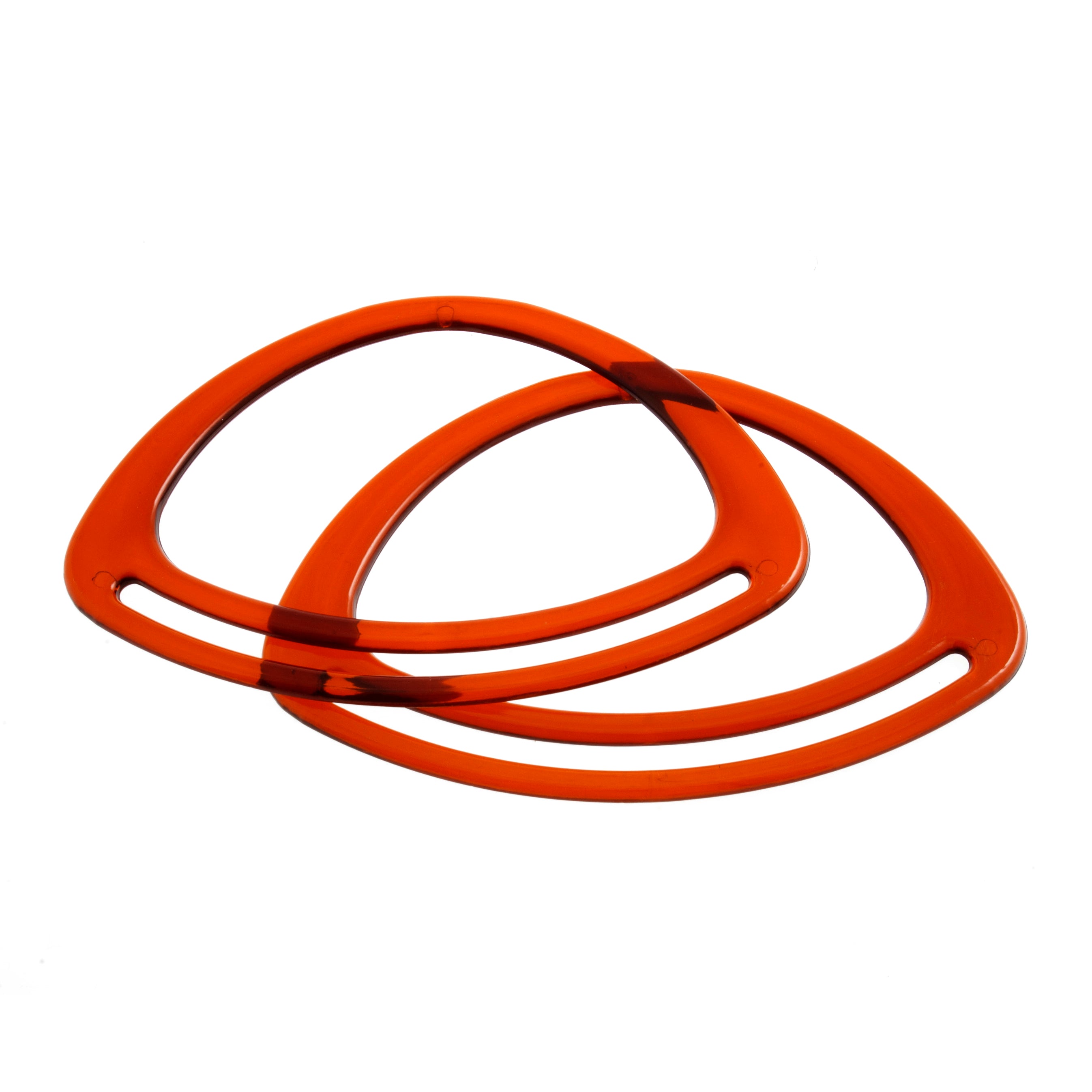 A pair of amber-colored oval plastic bag handles for bag making projects.