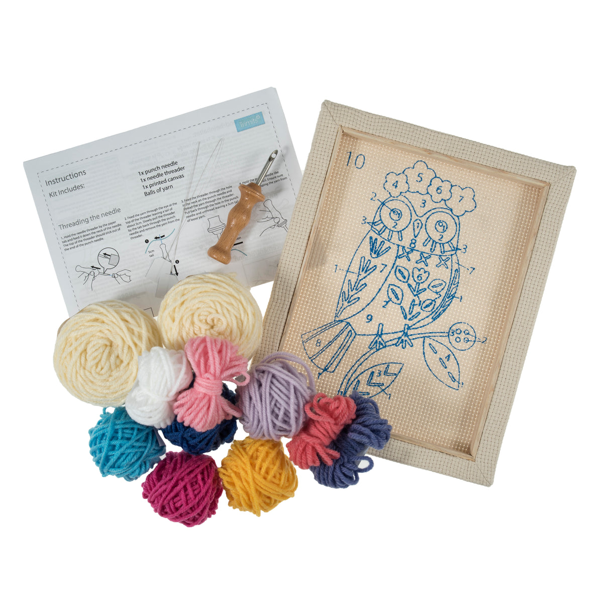 Punch needle kit featuring an owl design on a canvas frame with colorful yarn and tools.