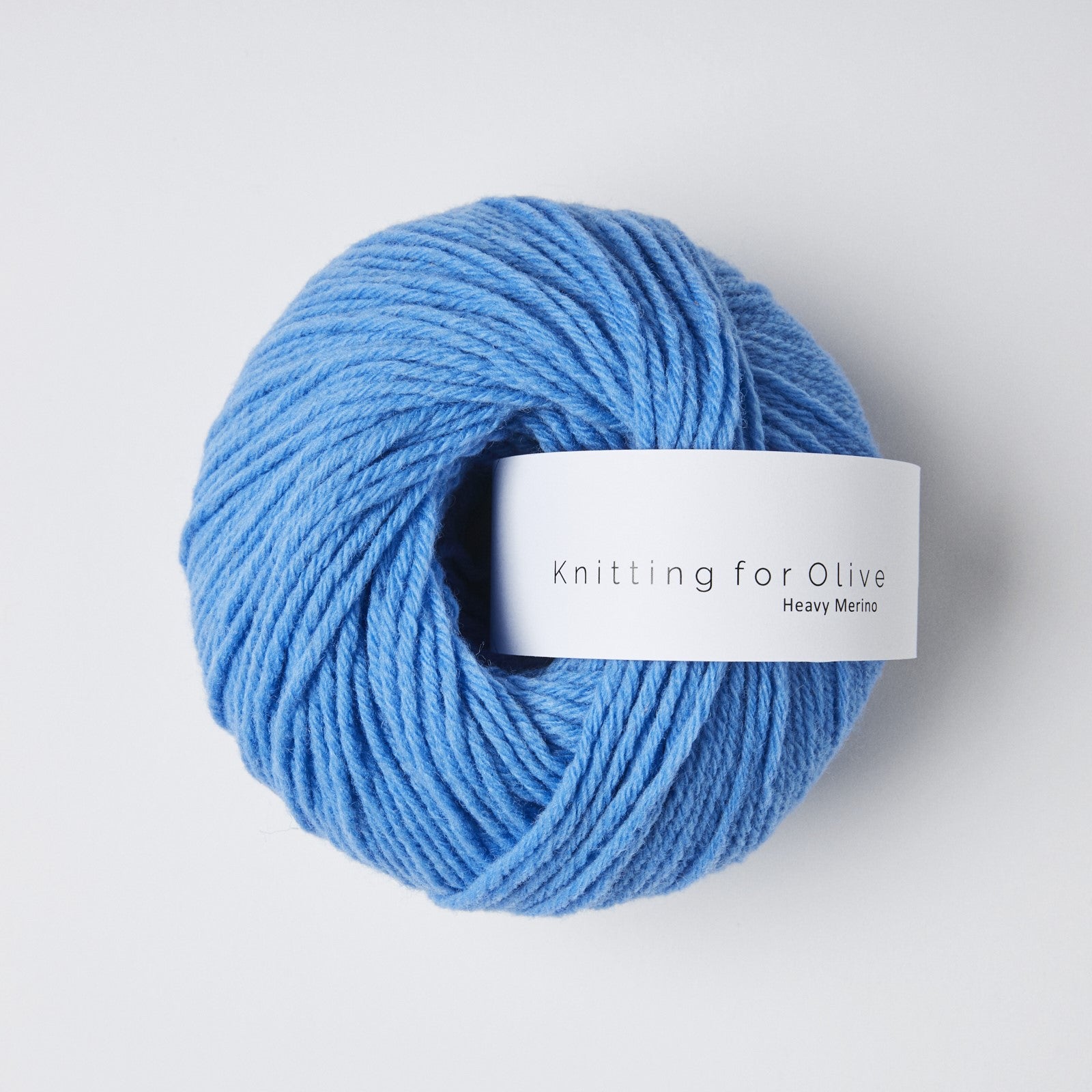 A ball of blue Heavy Merino yarn from Knitting for Olive.