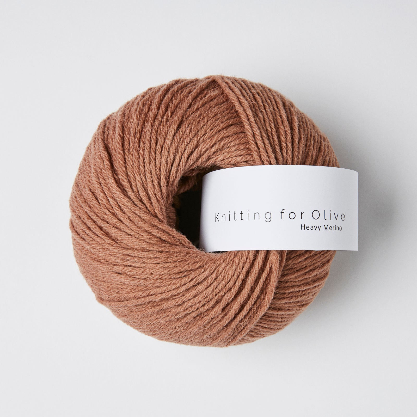 A ball of rustic brown Heavy Merino wool yarn from Knitting For Olive.
