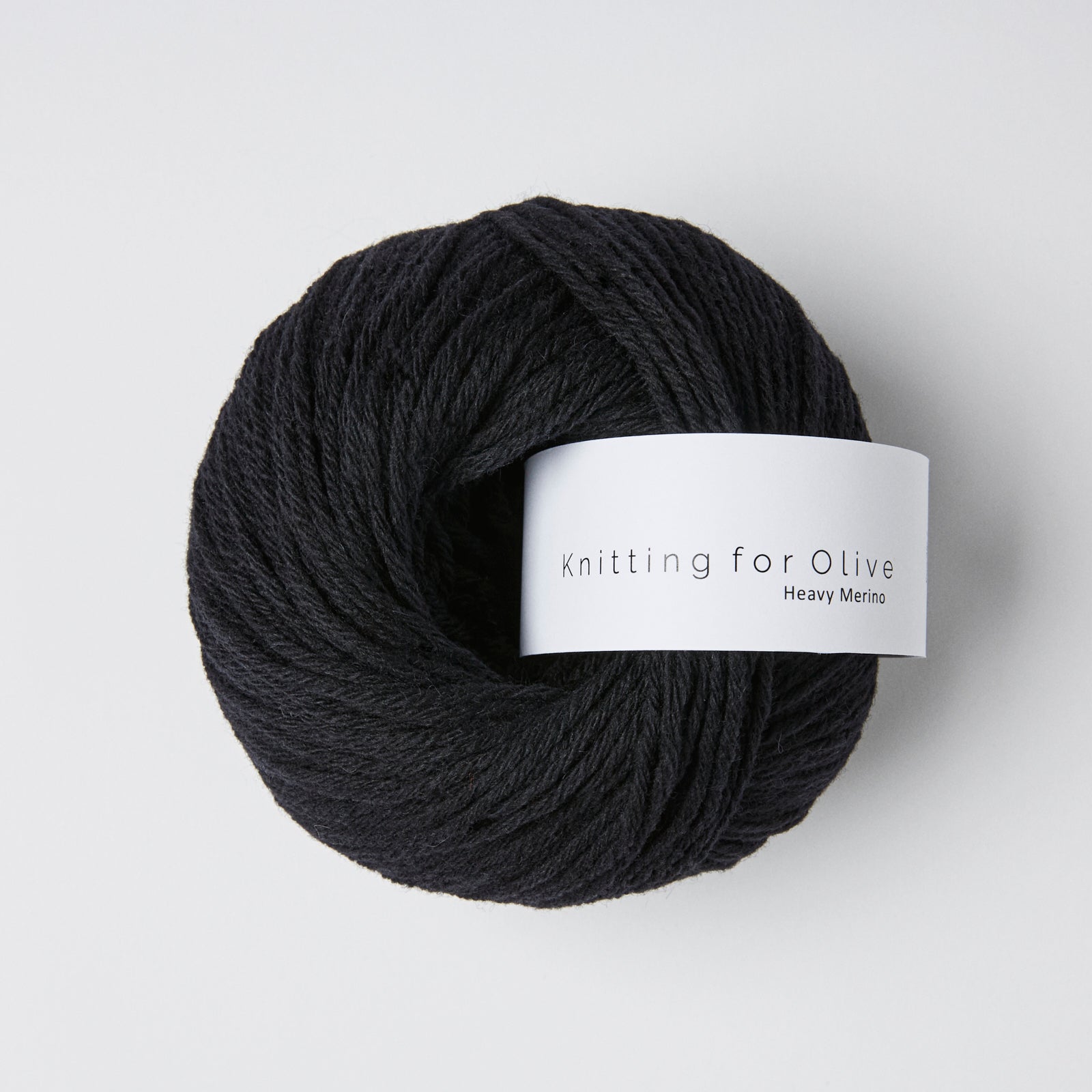 A ball of black Heavy Merino yarn from Knitting for Olive.