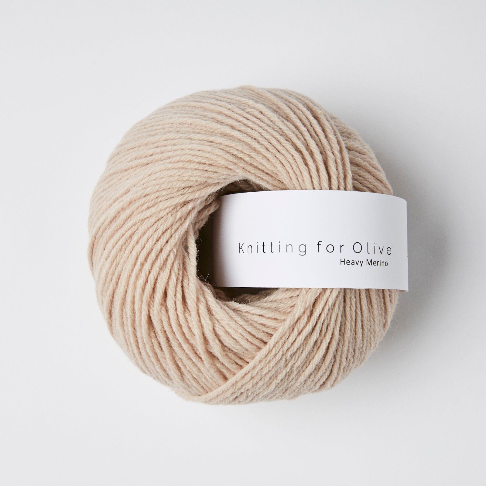 A ball of beige Heavy Merino yarn from Knitting For Olive.