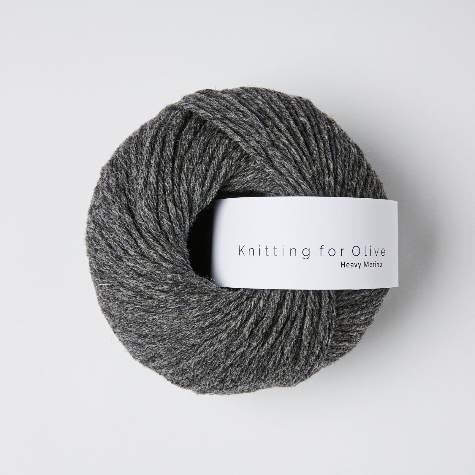 A ball of dark grey Heavy Merino yarn from Knitting For Olive.