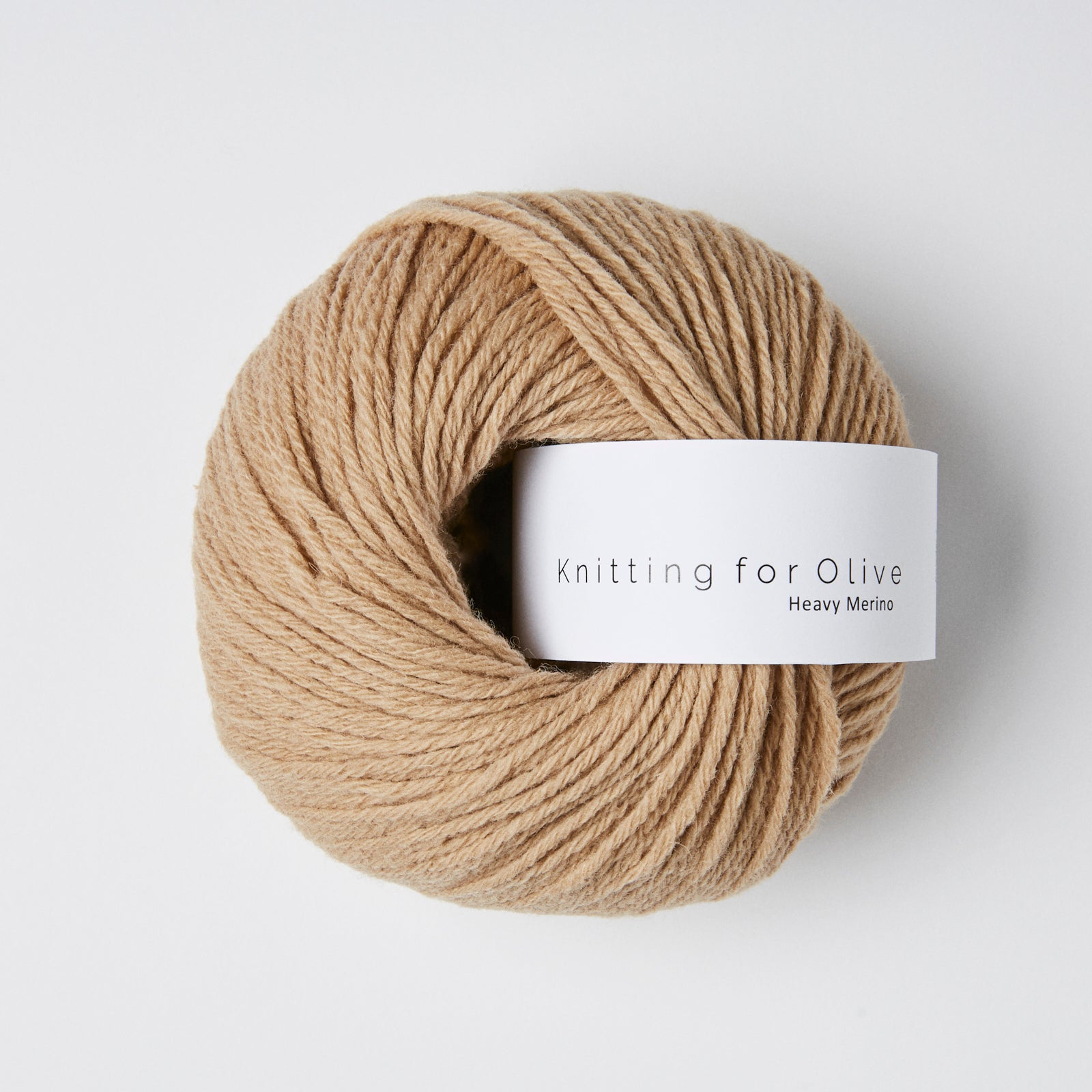 A ball of tan Heavy Merino yarn from Knitting for Olive.