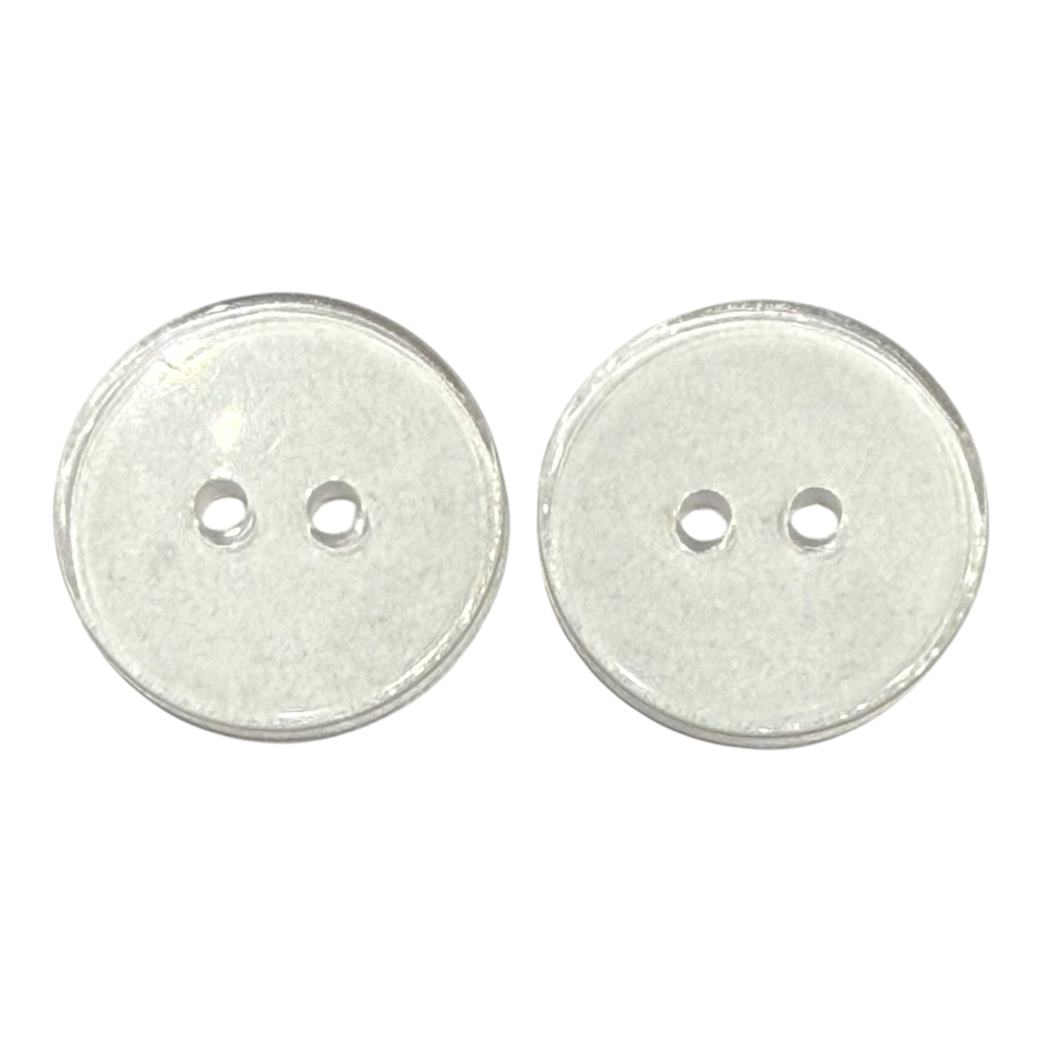 Two transparent 20mm round buttons with two holes each.