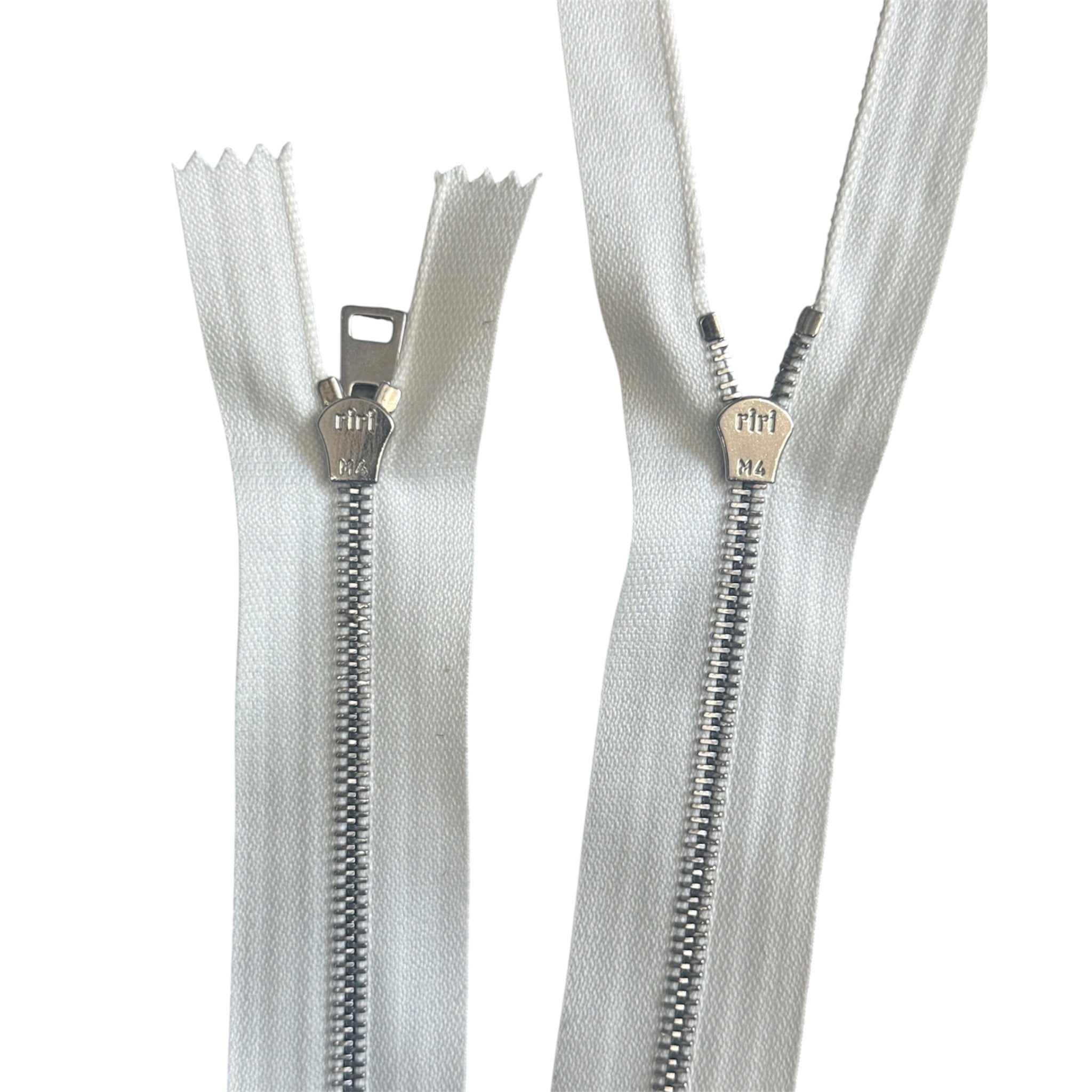 Riri 107cm white two-way separating zipper with silver metal teeth and branded sliders.